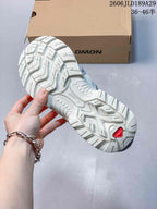 Close view of the lugged outsole on a Salomon XT-Quest ATHR sneaker.