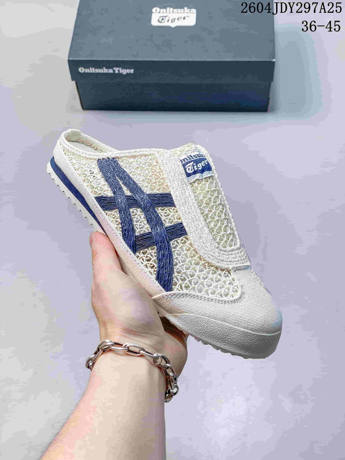 White Onitsuka Tiger Mexico 66 Sabot sneaker with navy side stripes and a navy outsole accent, shown with its box; the image shows style code 2604JDY297A25 and size range 36–45.