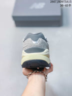 Rear view showing the padded heel, layered panels and contrasting outsole.