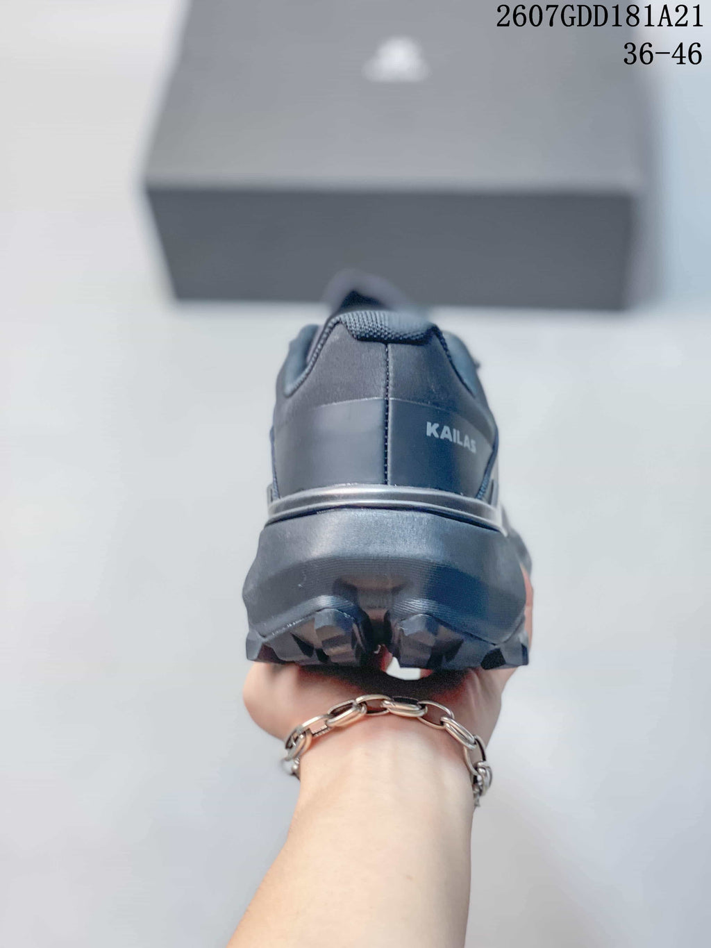 Rear view showing the KAILAS logo, heel structure and deep outsole lugs.