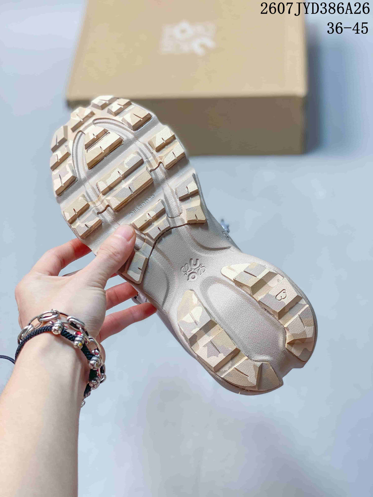 Underside view of a sneaker showing the sculpted outsole, separated traction blocks, and central molded details.