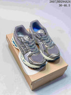 Pair of silver-gray ASICS Gel-Kayano 14 sneakers with blue accents displayed on a shoebox; image text shows style code 2607JHD294A24 and size range 36–46.5.