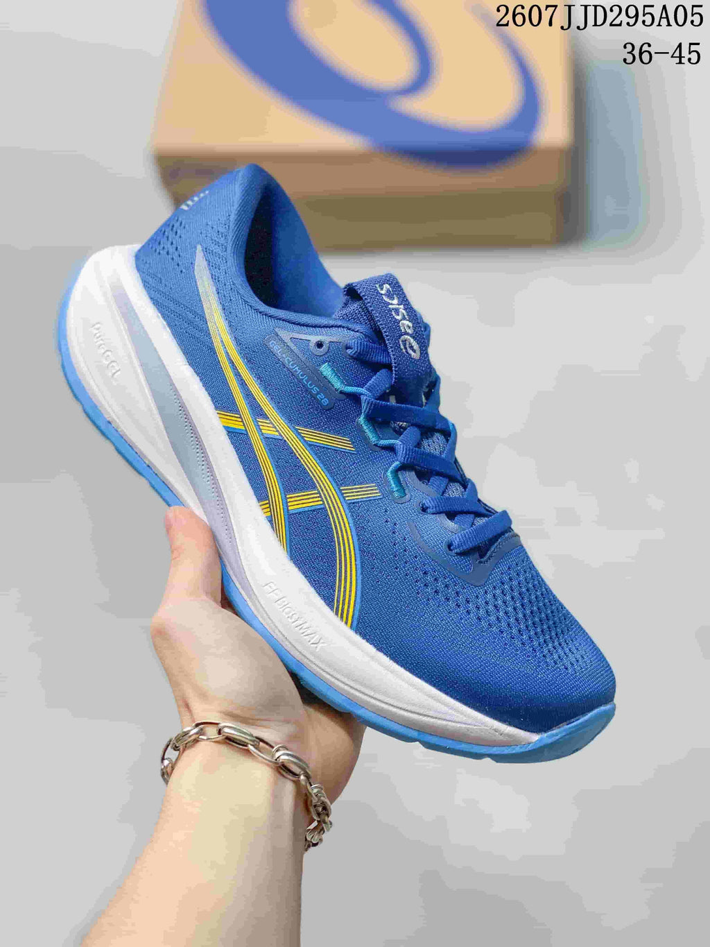 Blue ASICS running shoe with yellow side accents, white midsole, and blue outsole.