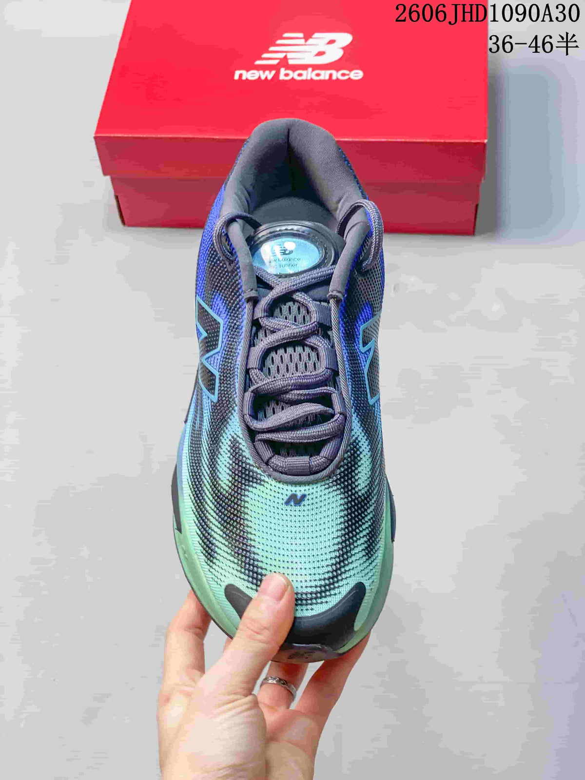 Top view of the lace-up shoe with a blue and mint patterned upper