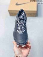 Top view of the sneaker showing the patterned laces, tongue, white lace details, and textured toe box.