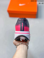 Rear view showing the black and pink heel, white midsole, and black outsole.
