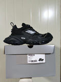 Black and white chunky sneaker displayed on its box; the box label shows style 0213, color BLACK/WHITE, and size E 40.