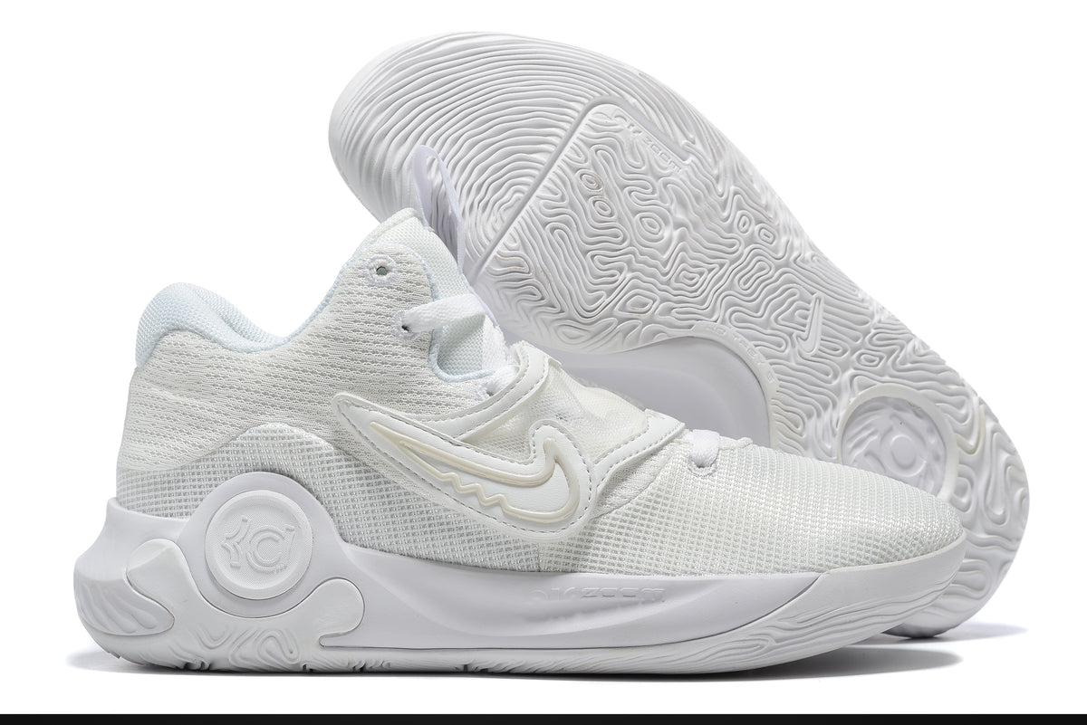 All-white Nike KD basketball shoes with a matching textured outsole.