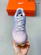 Top-down view showing the breathable-looking upper, laces, tongue, and lime toe accent.