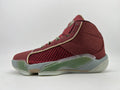 Side view of a burgundy Jordan high-top basketball shoe with olive-green accents and a light-colored midsole