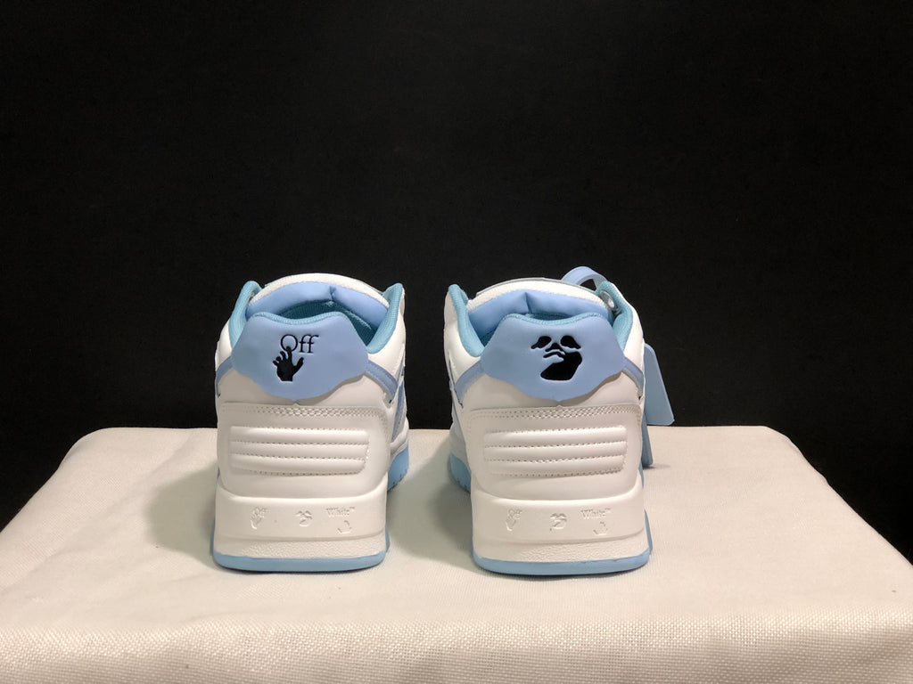 Rear view of the sneakers showing light blue heel collars, branded heel details and textured heel panels.