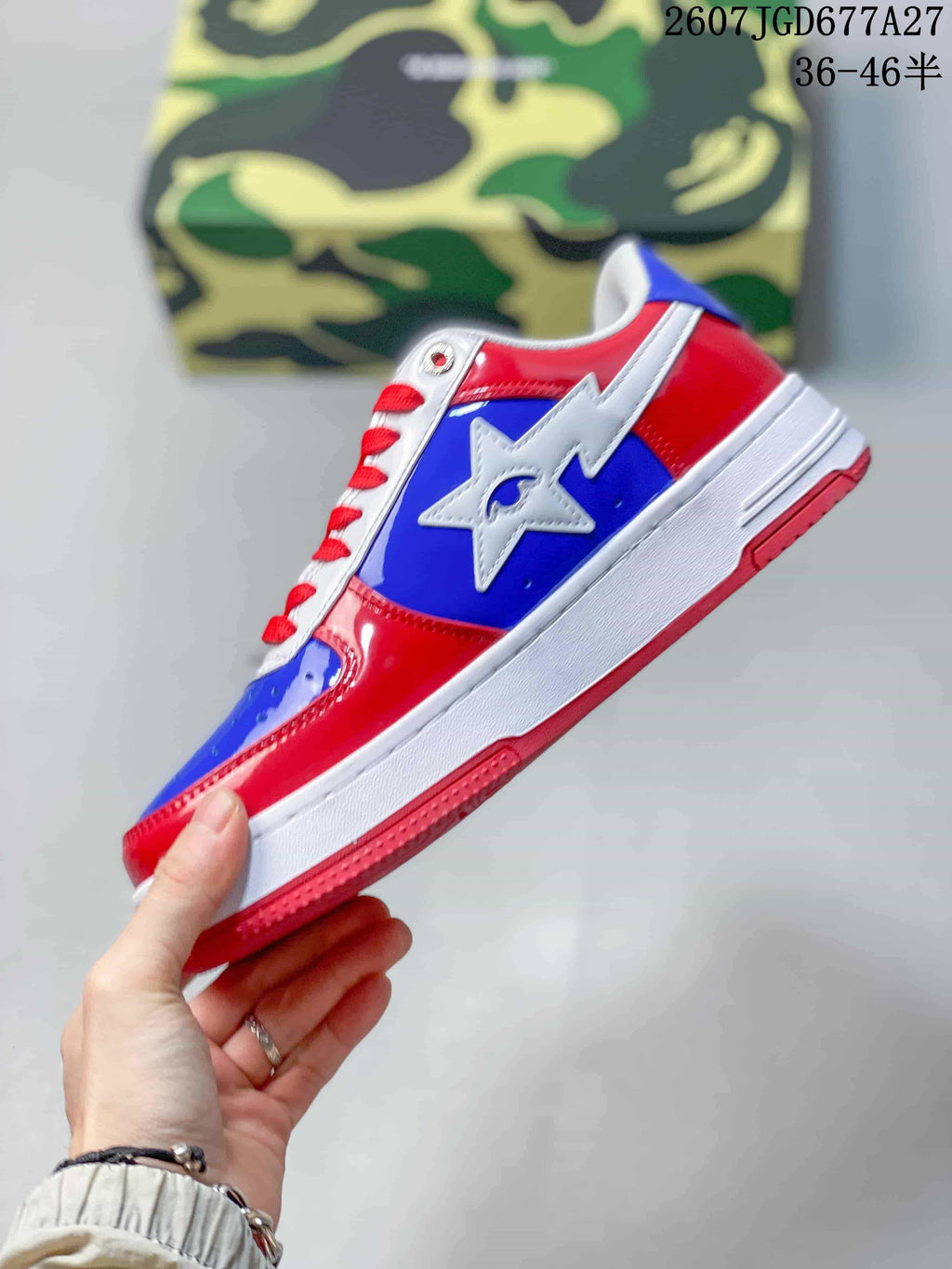 Side profile showing the red and blue upper, white star emblem, layered white midsole, and red outsole.