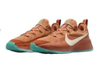 Warm orange Nike LeBron TR1 shoes with teal accents, product image