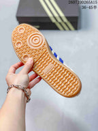 Close-up of the gum-colored outsole with textured traction pattern and adidas branding.