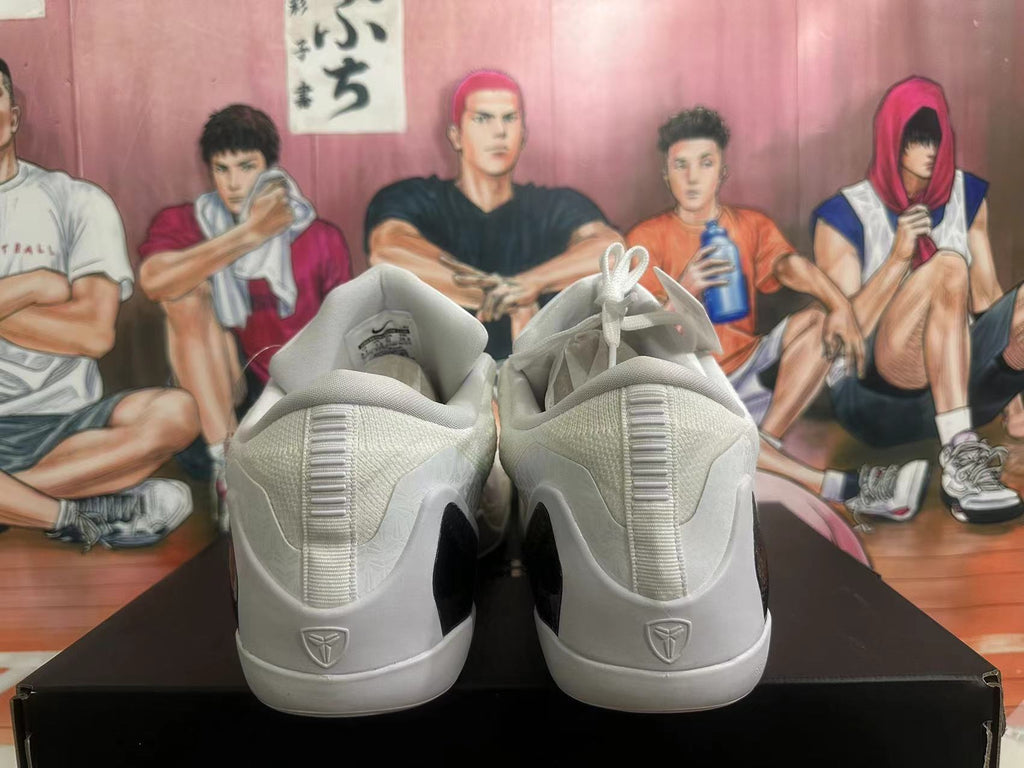 Rear view of white and black Nike basketball shoes