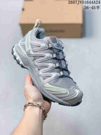 Angled side view highlighting the layered upper, padded collar and low-top silhouette.