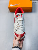 Top view showing white laces, a red padded collar, and red textured toe detailing.