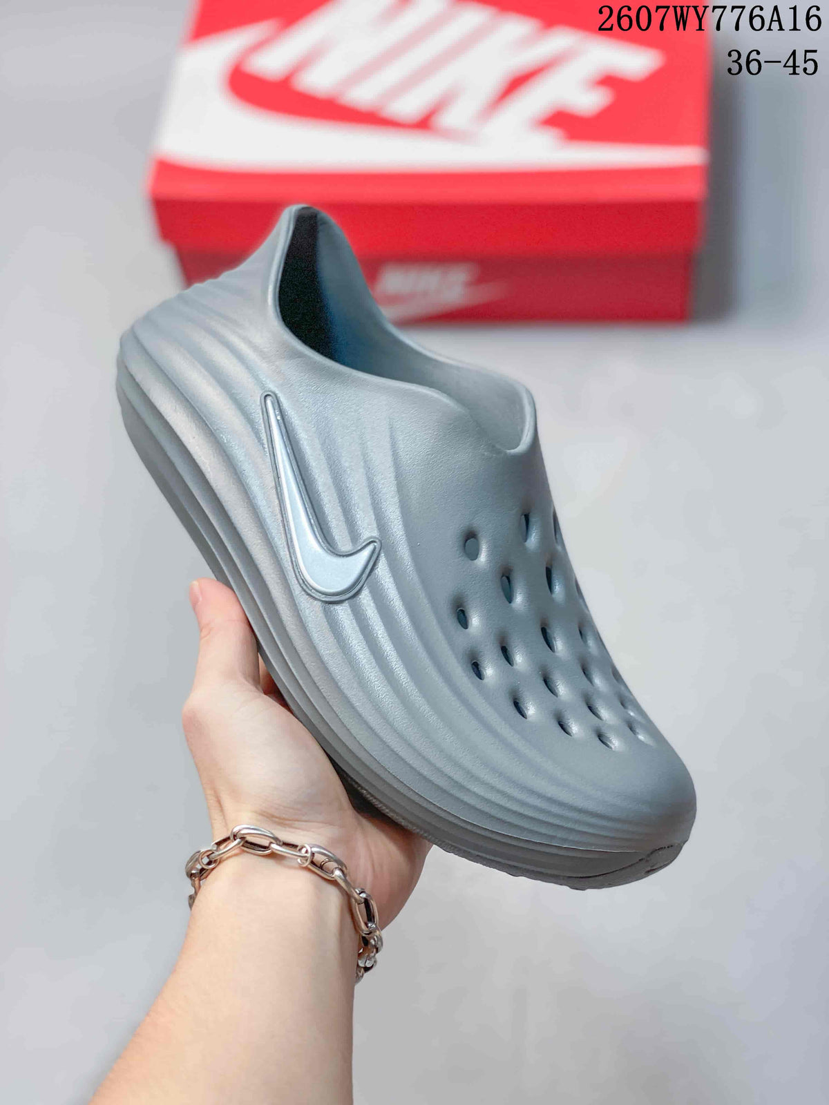 Angled side view showing the perforated upper, raised side logo, and sculpted sole.