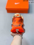 Rear view showing the heel branding, padded collars and orange outsole.
