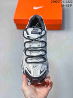 Top view of the sneaker showing the layered lace arrangement, perforated tongue area, and contrasting toe details.