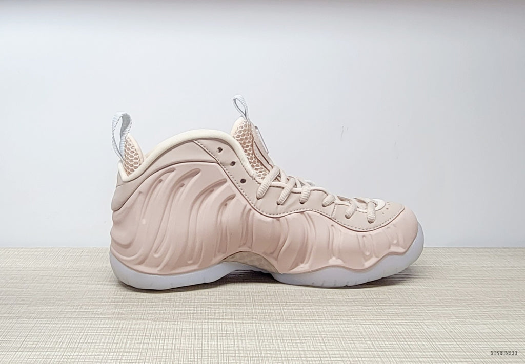 Side profile of the blush-pink high-top sneaker with sculpted panels