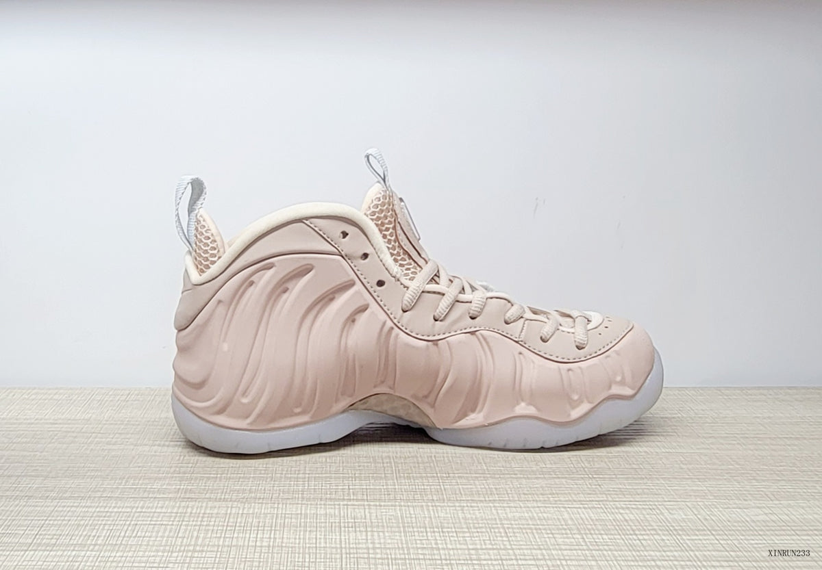 Side profile of the blush-pink high-top sneaker with sculpted panels