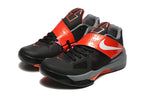 Pair of black and red Nike KD 4 shoes with red midfoot straps and gray midsoles.