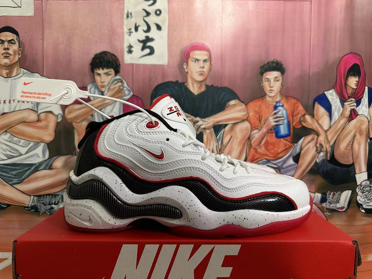 Side view of white, red, and black Nike Air Zoom Flight 96 basketball shoes