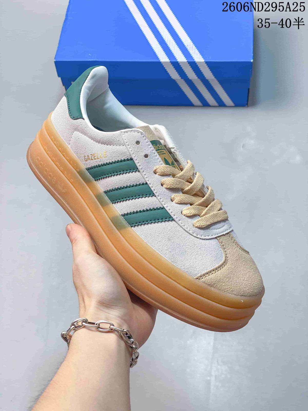 White and beige Adidas Gazelle Bold W sneaker with green stripes and a gum-colored platform sole
