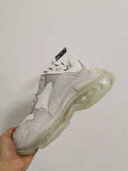 Rear-side view of the white Balenciaga sneaker highlighting the layered panels and translucent sole.