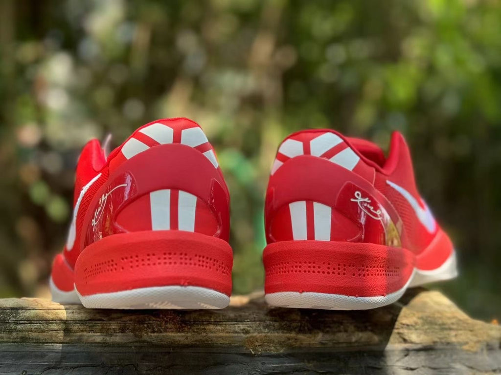 Rear view of red Nike Kobe 8 shoes with white heel accents