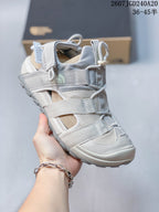 Angled close-up of the sandal showing the The North Face branding, adjustable straps, mesh panels, and outsole.