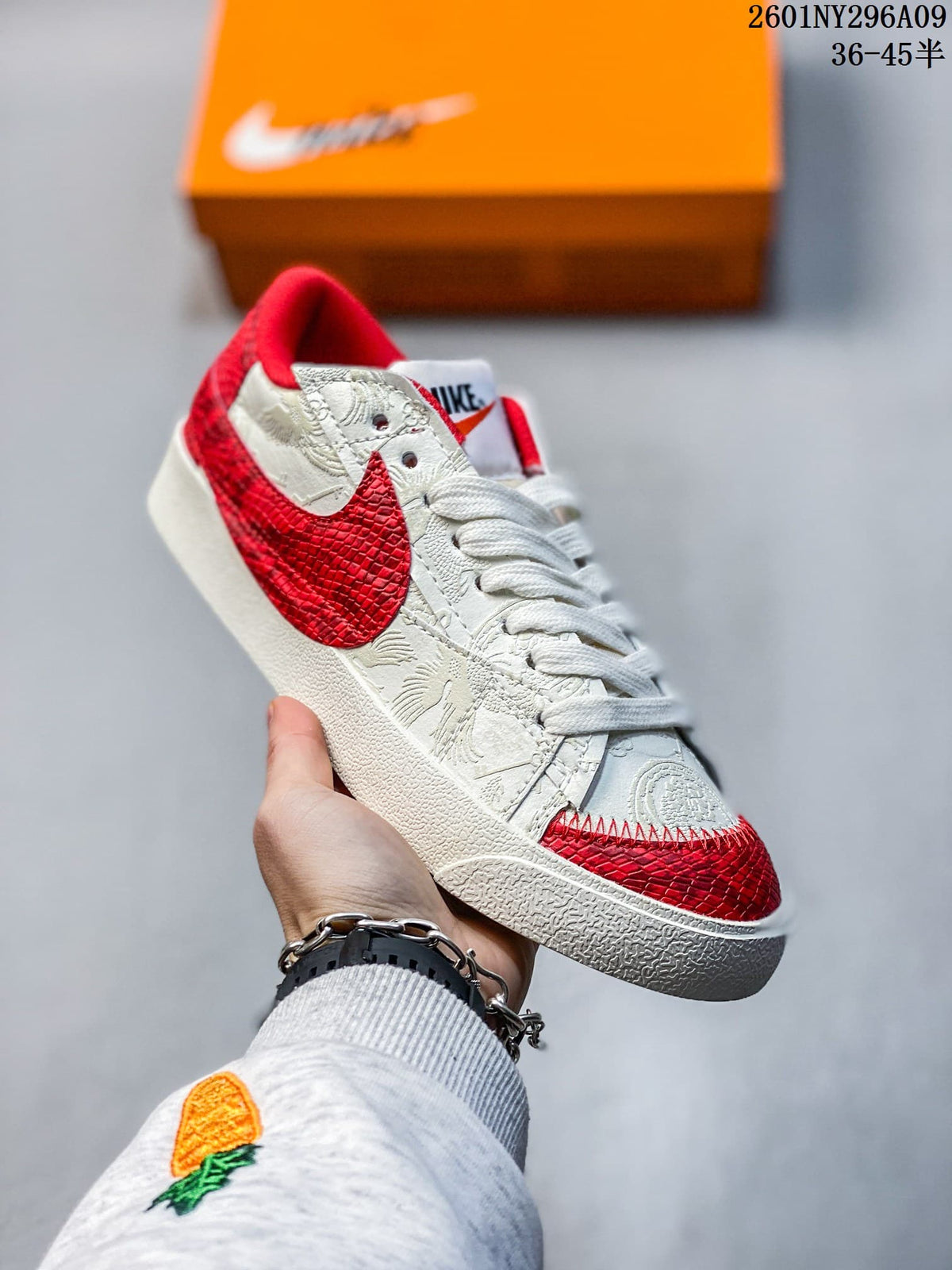 White Nike Blazer Low ’77 Jumbo sneaker with a textured red Swoosh and red accents