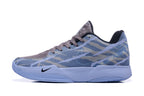 Side profile showing the blue-gray upper, Nike swoosh, and light-blue sole