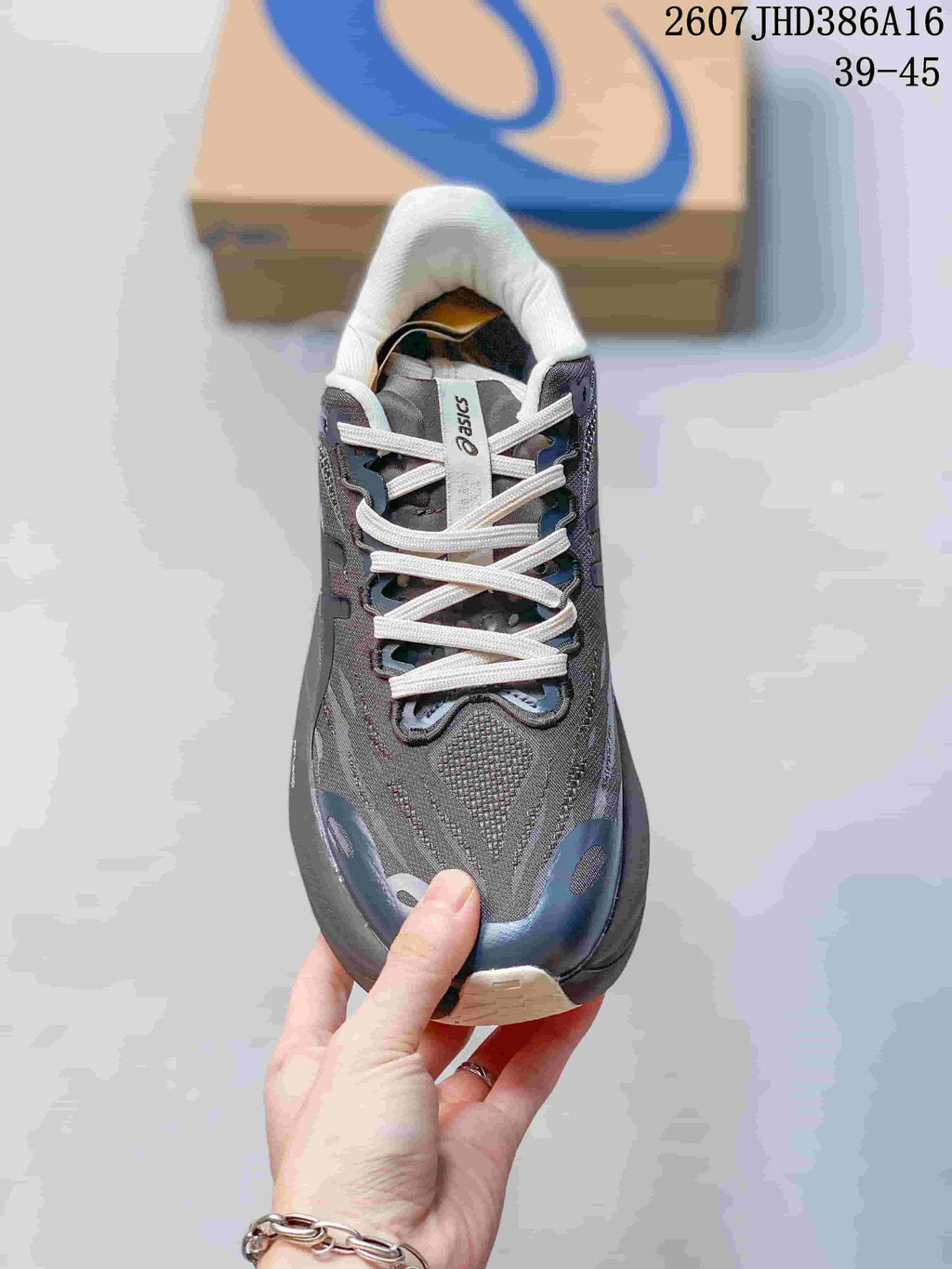 Top view showing the mesh-style upper, white laces, and ASICS tongue branding.