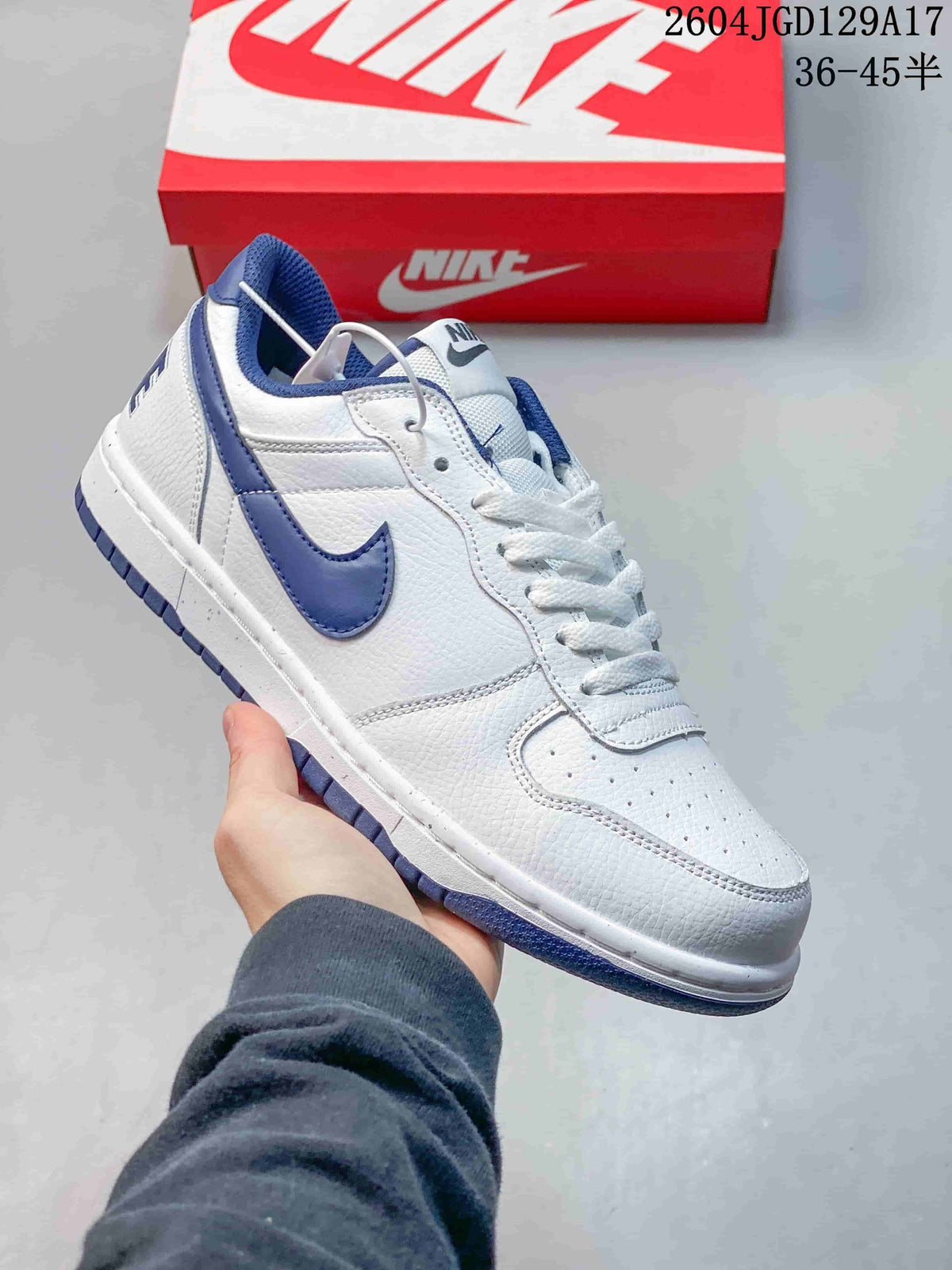 Angled side view of the white and blue low-top sneaker