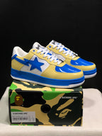 Blue and yellow BAPE STA sneakers displayed on a branded shoe box