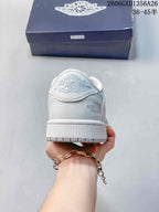 Rear view showing heel details and side branding on a white sneaker