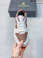 Top view showing white laces, a brown perforated toe panel, and Jordan tongue branding.