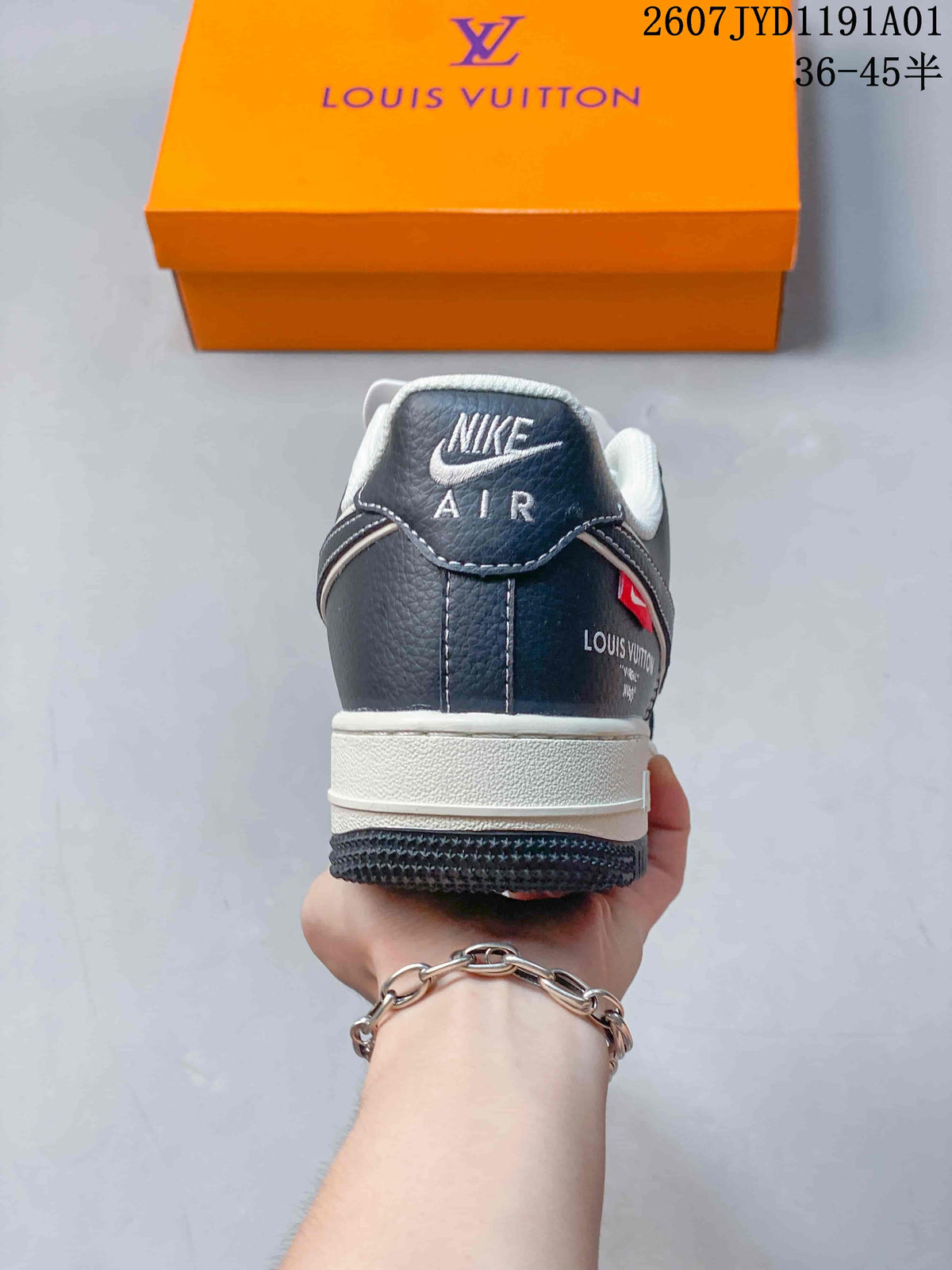 Rear view showing the navy heel panel, white stitching, and padded collar