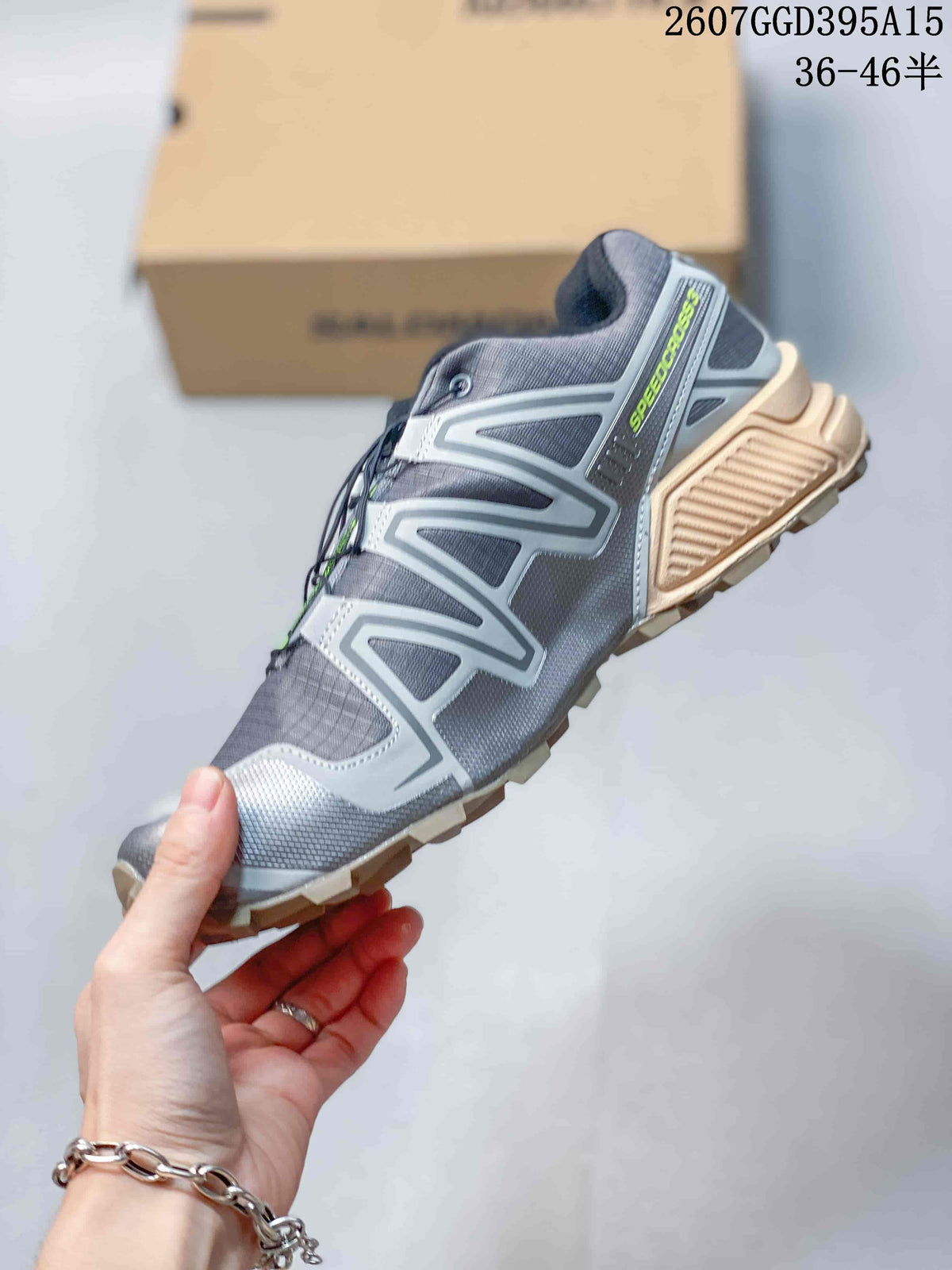 Side profile of the gray Salomon SPEEDCROSS 3 shoe with silver overlays, lime branding, and a textured outsole.