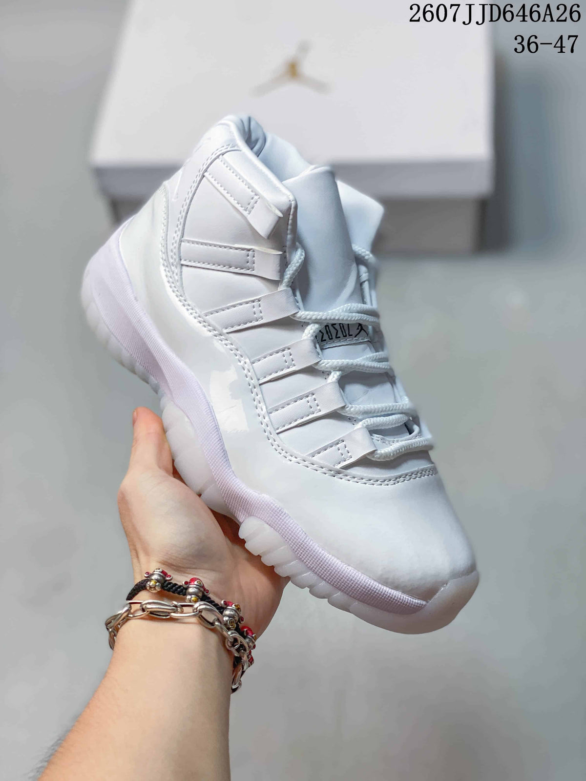 Three-quarter side view of the white high-top sneaker with padded collar, layered panels and translucent sole.