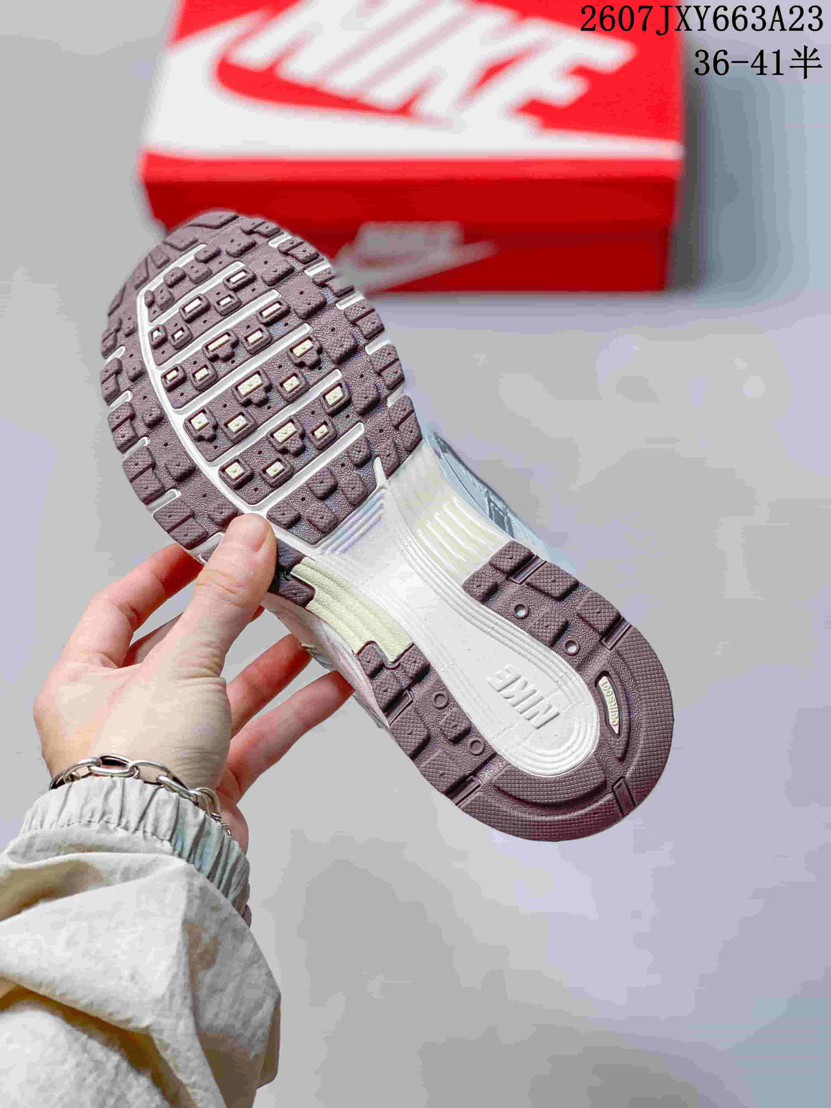 Underside of a Nike sneaker showing the molded outsole tread pattern.