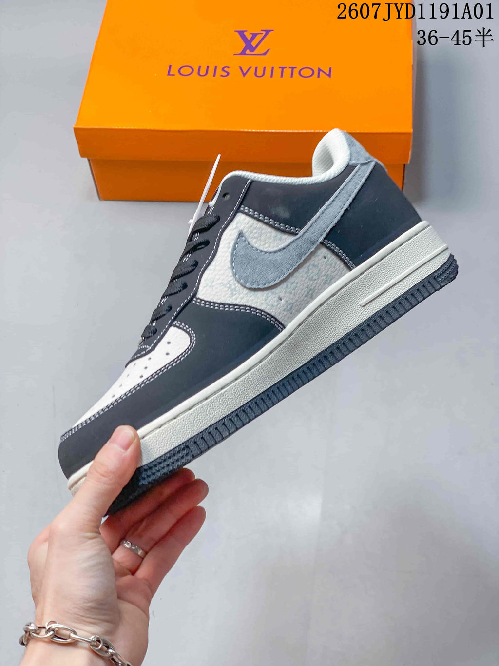 Side view of the sneaker with gray swoosh and contrasting panels