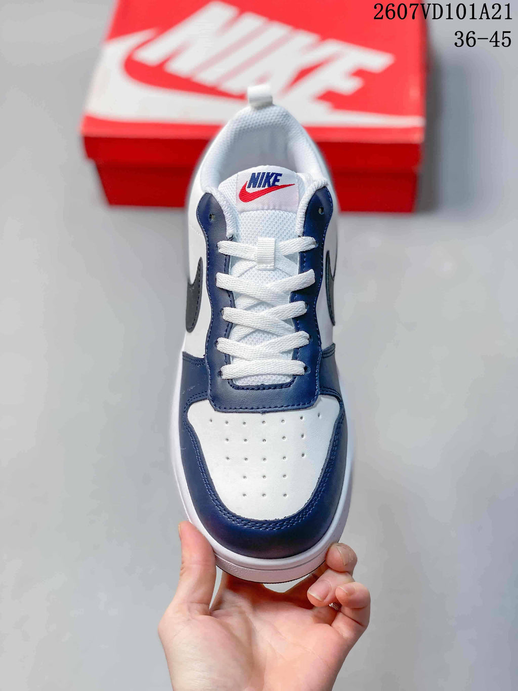 Top view showing the white perforated toe, navy overlays and white laces.