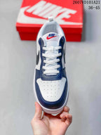 Top view showing the white perforated toe, navy overlays and white laces.