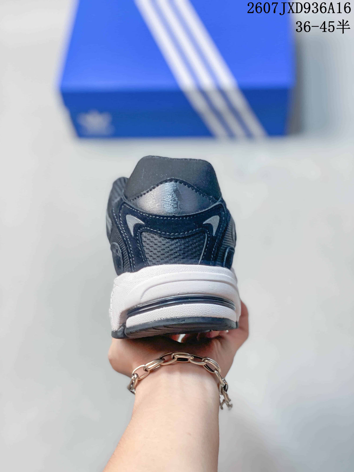 Rear view showing the padded heel, dark mesh panels and white midsole.