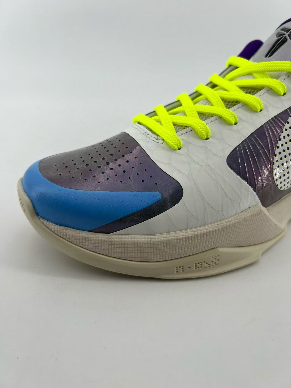 Close-up of the perforated toe panel and blue accent