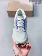 Top view showing the rounded toe, laces and blue lace-area accents