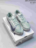 Pair of pale green and white Nike ACG Ultrafly Trail sneakers with navy accents displayed on an ACG shoebox; image text shows 2607JYD260A20 and 36–46 half sizes.